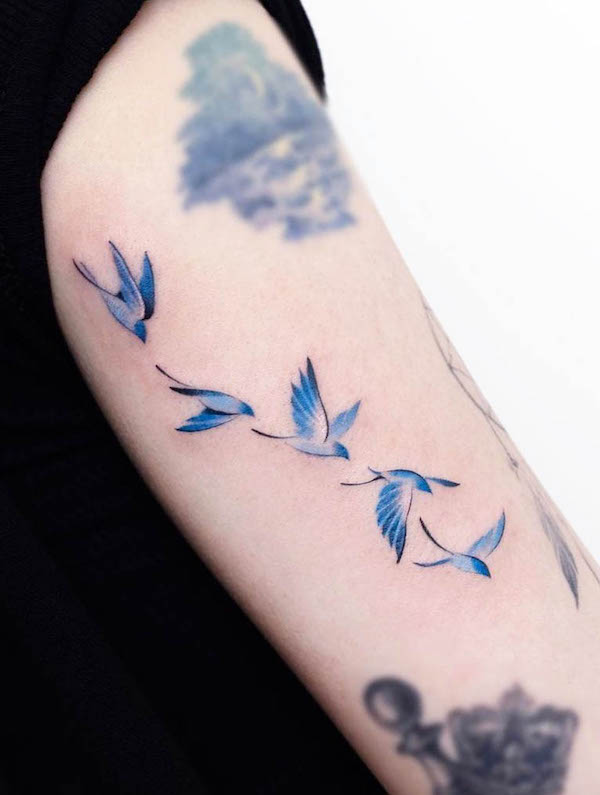 Flying birds by @foret_tattoo
