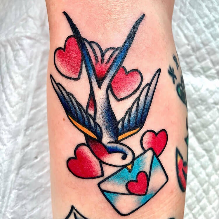 swallow bird carrying love letter tattoo