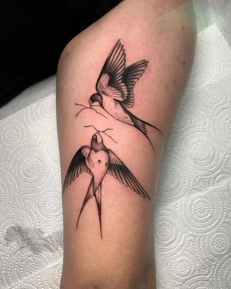 two swallow birds tattoo