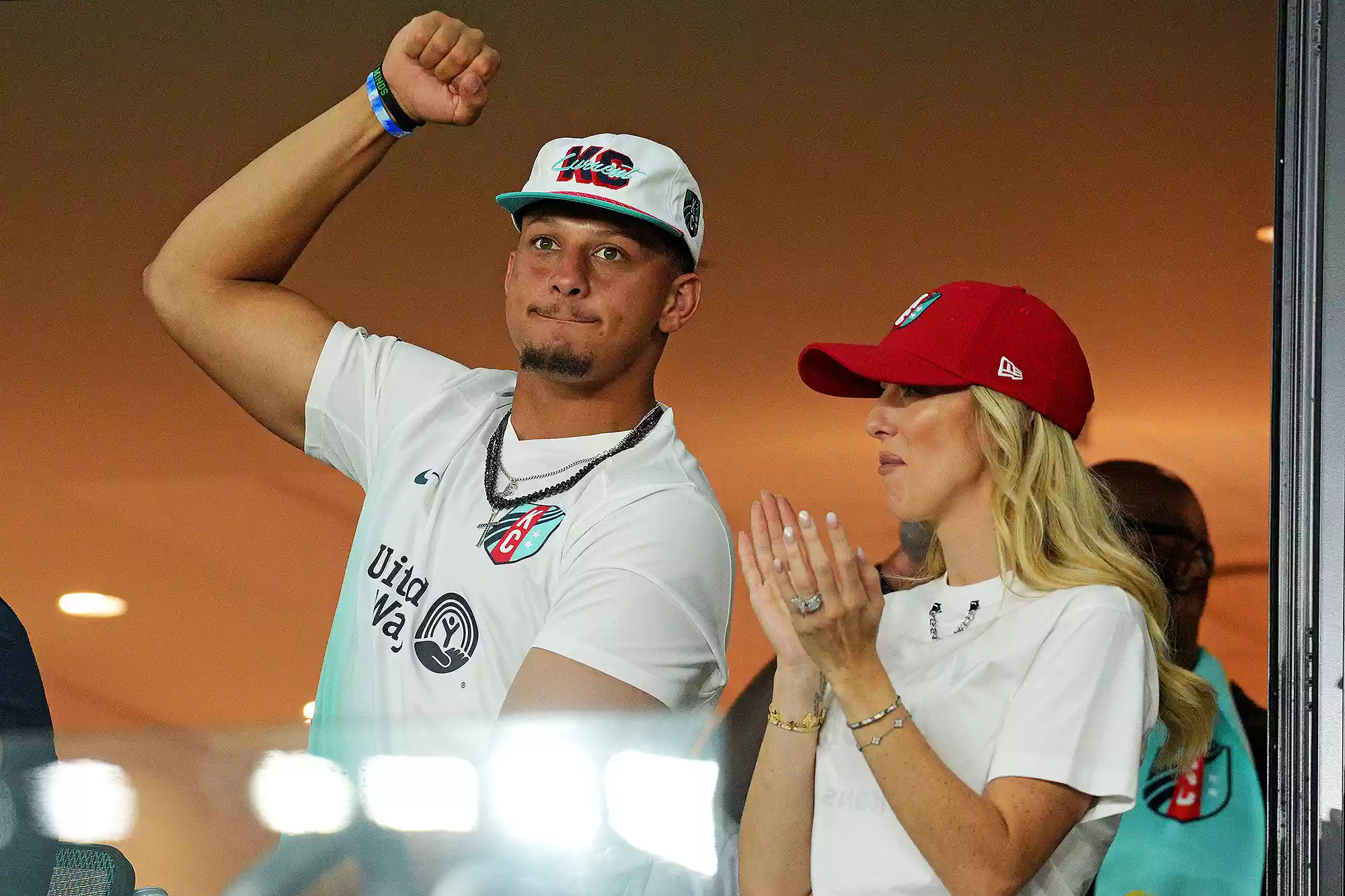 Patrick Mahomes and Brittany Mahomes cheer during the game between the Kansas City Current and Atletico De Madrid 