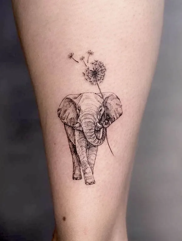 Dandelion and elephant tattoo by @maymay.tattoo