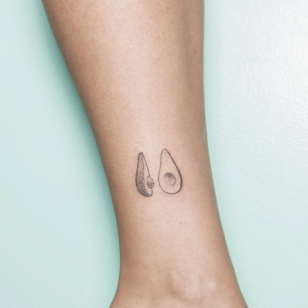 Small delicate sliced avocado wrist tattoo