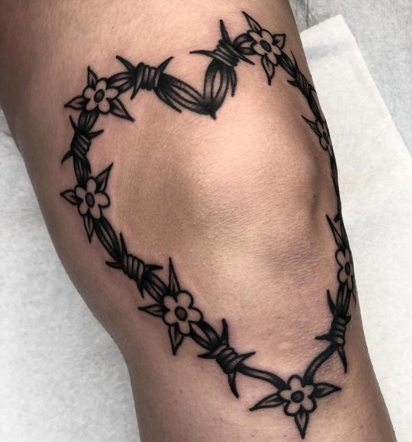 Barbed wire heart tattoo knee