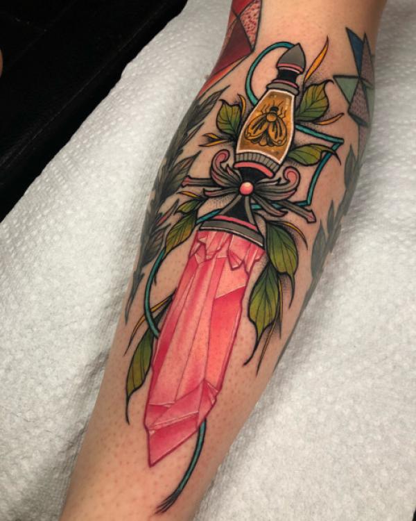 Crystal dagger with leaves tattoo forearm