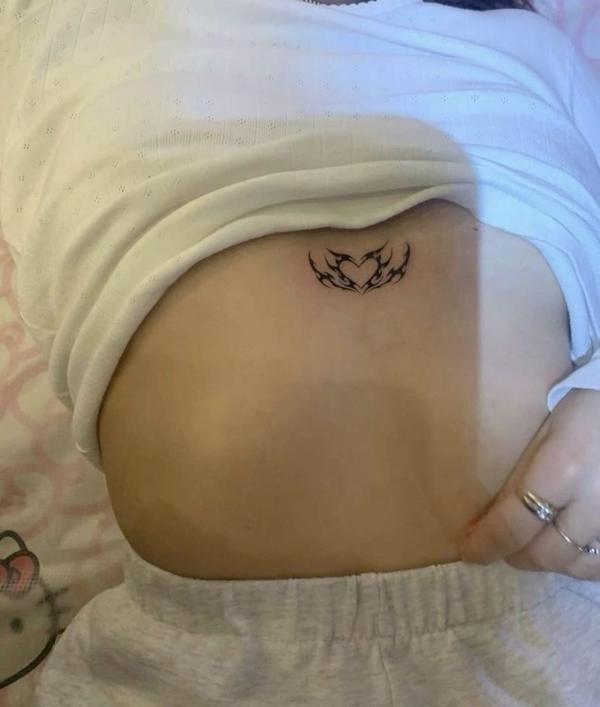 Heart cyber sigilism belly button tattoo