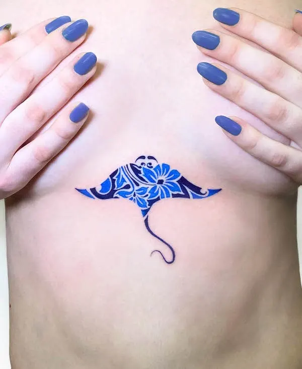 Porcelain devil fish tattoo between boobs by @tatuaggidiporcellana