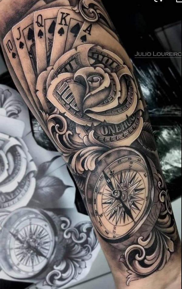 Spade playing cards and money rose with compass tattoo forearm