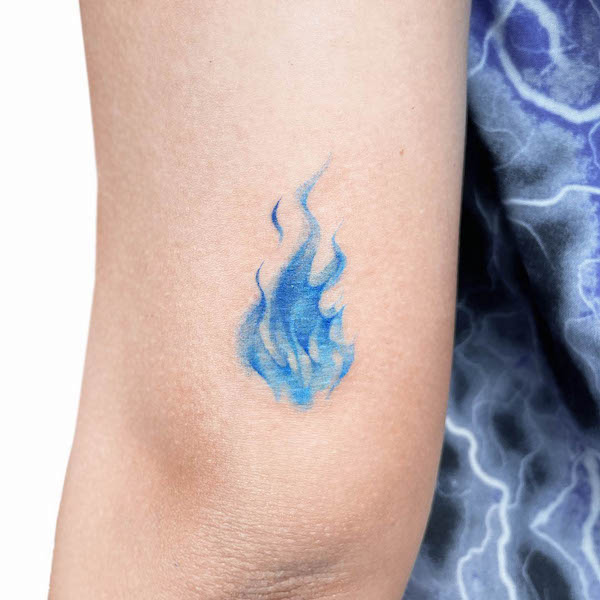 Beautiful blue flame tattoo by @uzotattoo