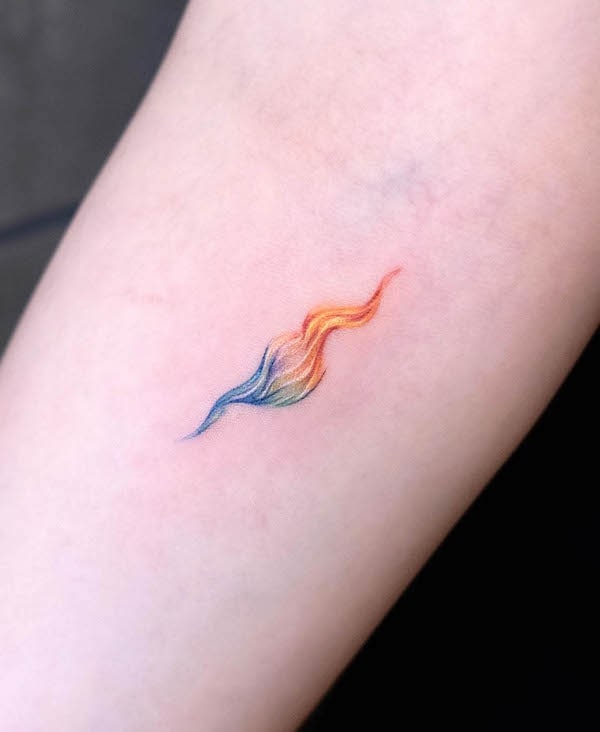 Small colorful flame tattoo by @newtattoo_demi