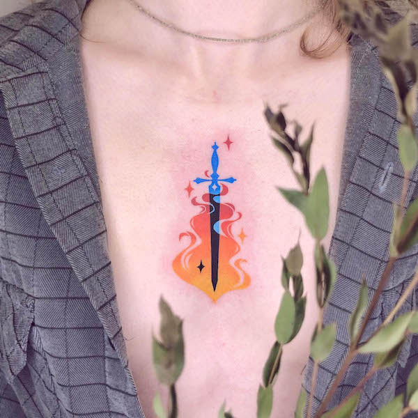 Fire sword chest tattoo by @efter.image_tatts