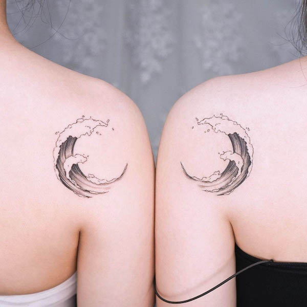 Matching wave shoulder tattoos by @simya_tattoo