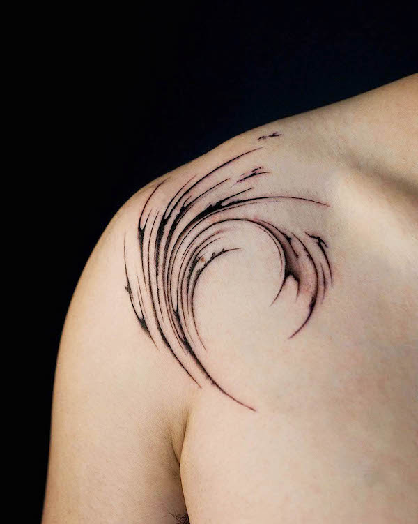 Stylized wave shoulder tattoo by @tattooist.pado