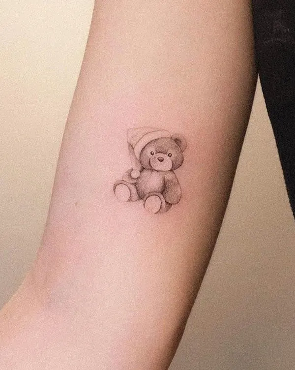 Small Christmas teddy bear tattoo by @stefano__mazza