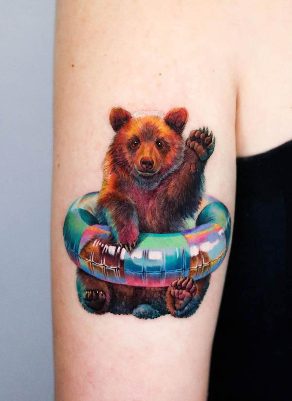 Bear with swim buoy tattoo by @non_lee_ink