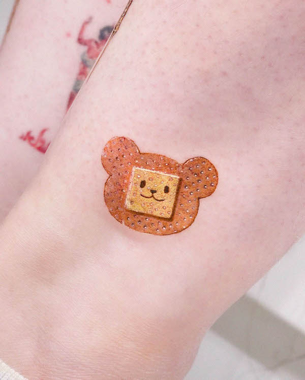 Bear bandaid tattoo by @siihee.tattoo