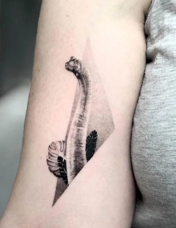 Geometric brachiosaurus arm tattoo by @gyorgyforis_