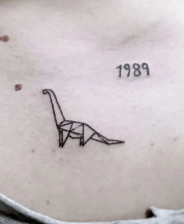 Origami geometric dinosaur tattoo by @catexishandpoke