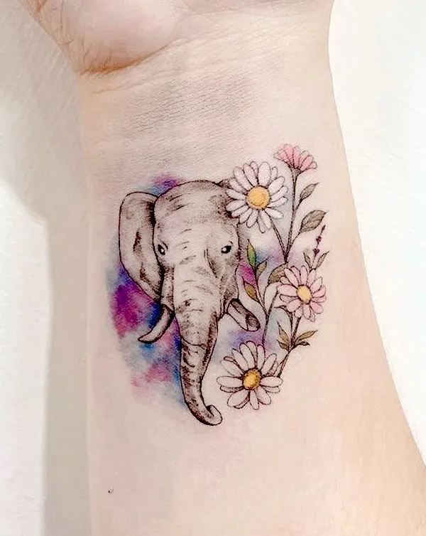 Floral elephant wrist tattoo by @777.twilight_tattoo