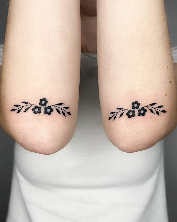 Floral elbow tattoos by @daniscaringe