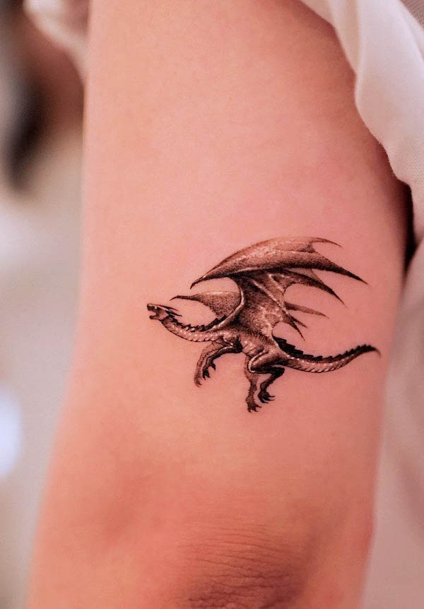 Tiny dragon tattoo by @tattooist.inno