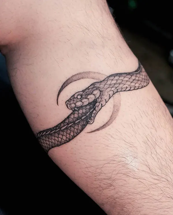 Moon ouroboros wrap around tattoo by @khalblk