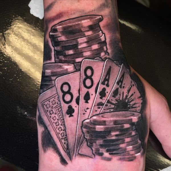 playing cards and poker chips tattoo hand