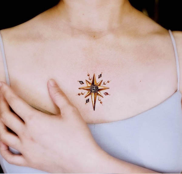 Golden star middle chest tattoo for women by @chou_ta_1