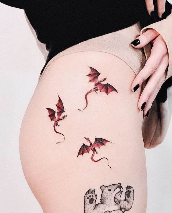 Red dragons hip tattoo by @vanzotattoo