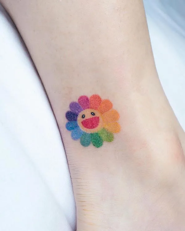 Super cute rainbow flower ankle tattoo by @keenetattoo