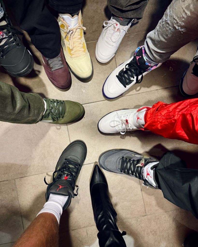 Travis Kelce’s friends included the singer in their sneaker photo.