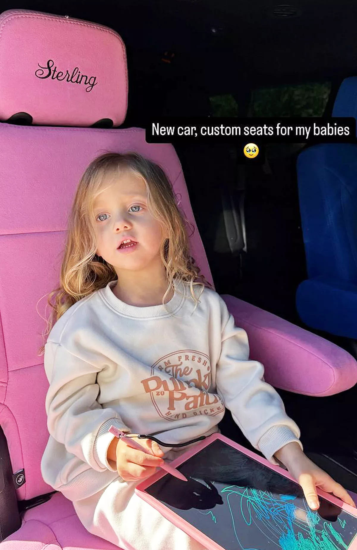 Brittany Mahomes child in a custom car seat