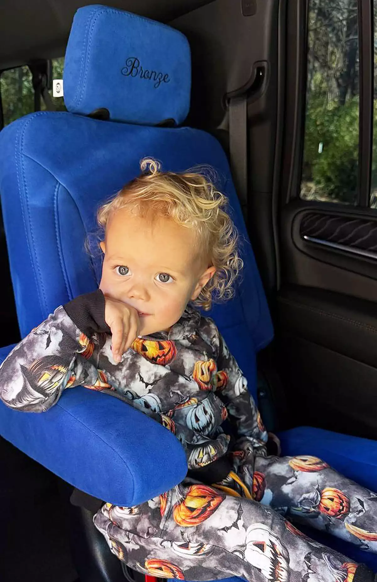 Brittany Mahomes child in a custom car seat