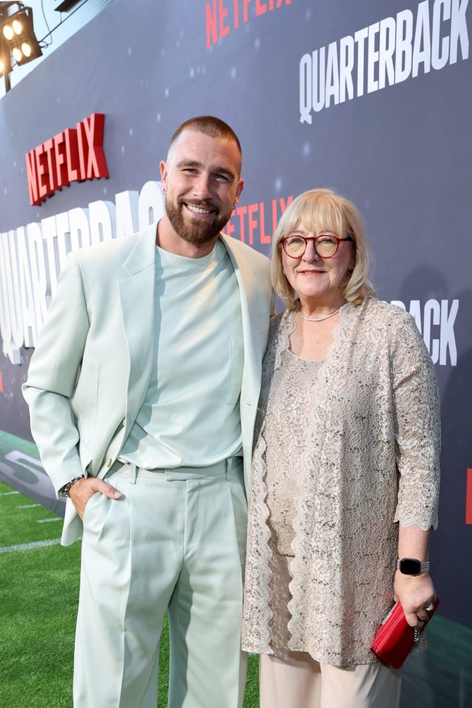 Travis Kelce and Donna Kelce posing for a photo at the Netflix Premiere of 'Quarterback' in Los Angeles, California on July 11, 2023