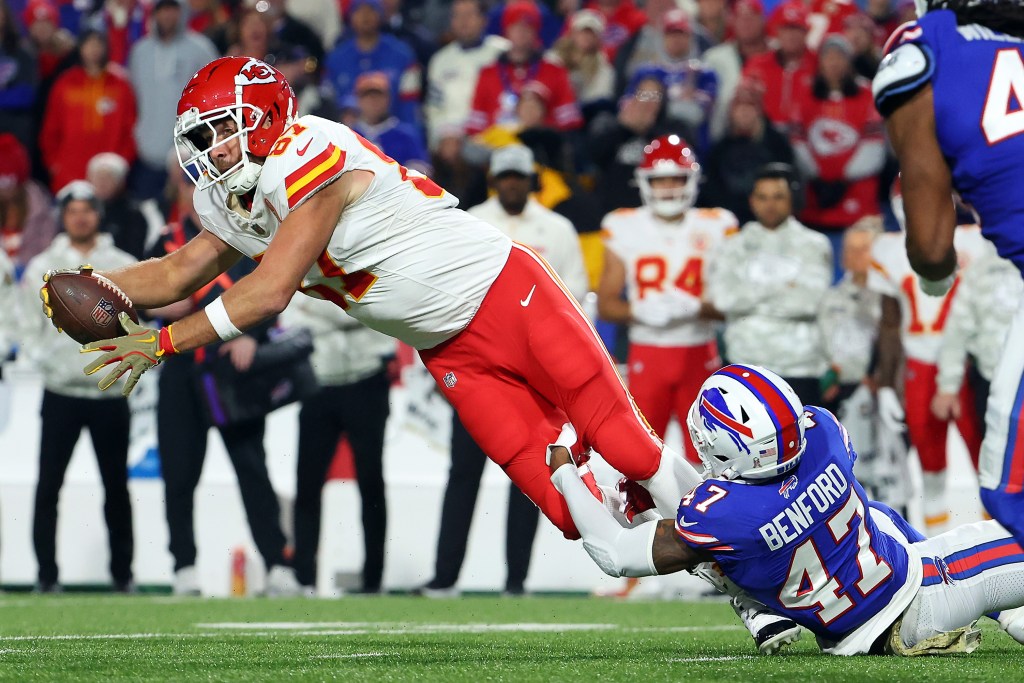 Travis Kelce #87 of the Kansas City Chiefs makes a catch against Christian Benford #47 of the Buffalo Bills during the third quarter at Highmark Stadium on November 17, 2024 in Orchard Park, New York.