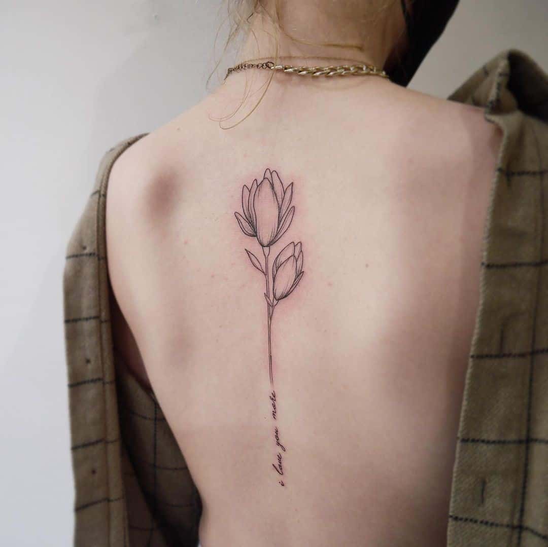 Lotus Flower Tattoo Spine Idea