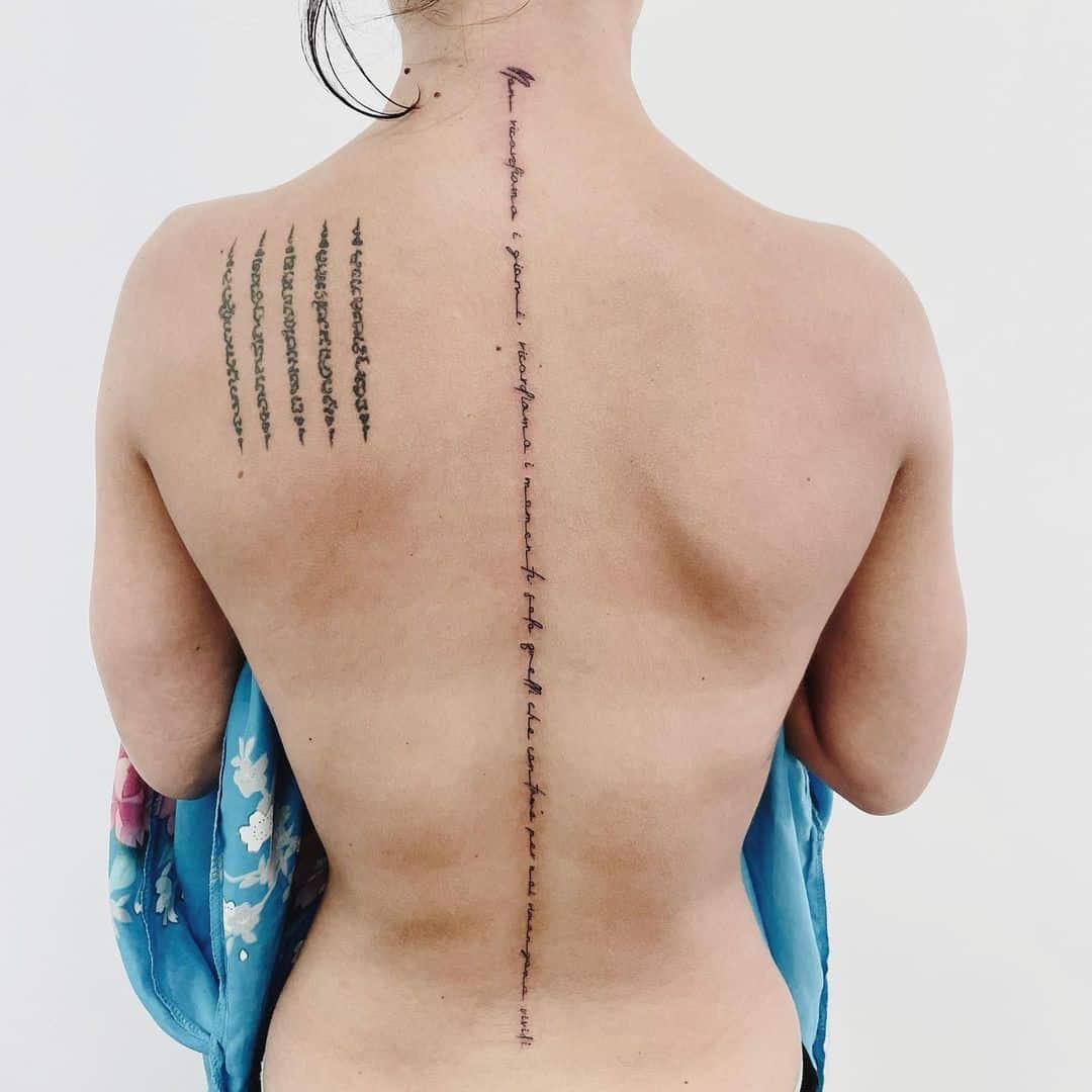 Quote Across The Back Spine Tattoo