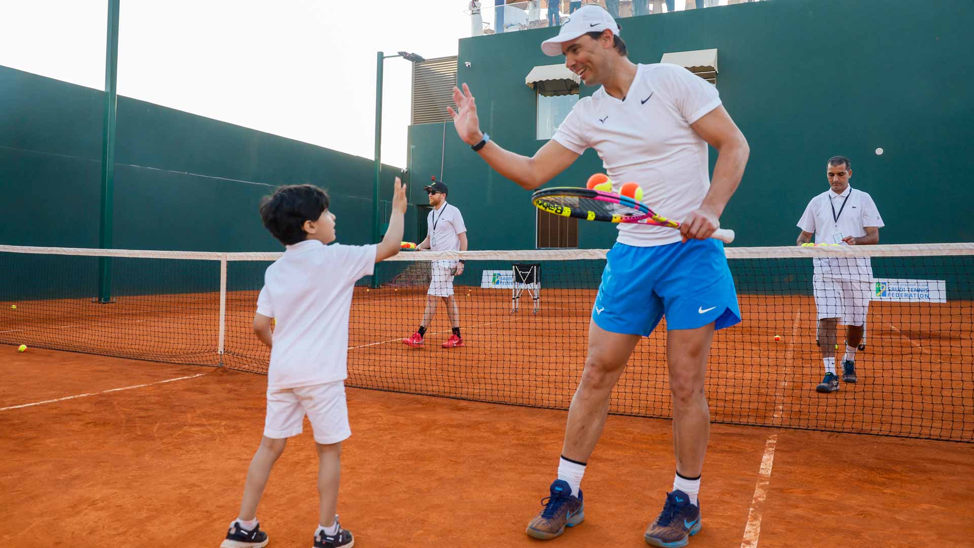 Rafael Nadal on court with a young tennis player on Saturday in Jeddah.