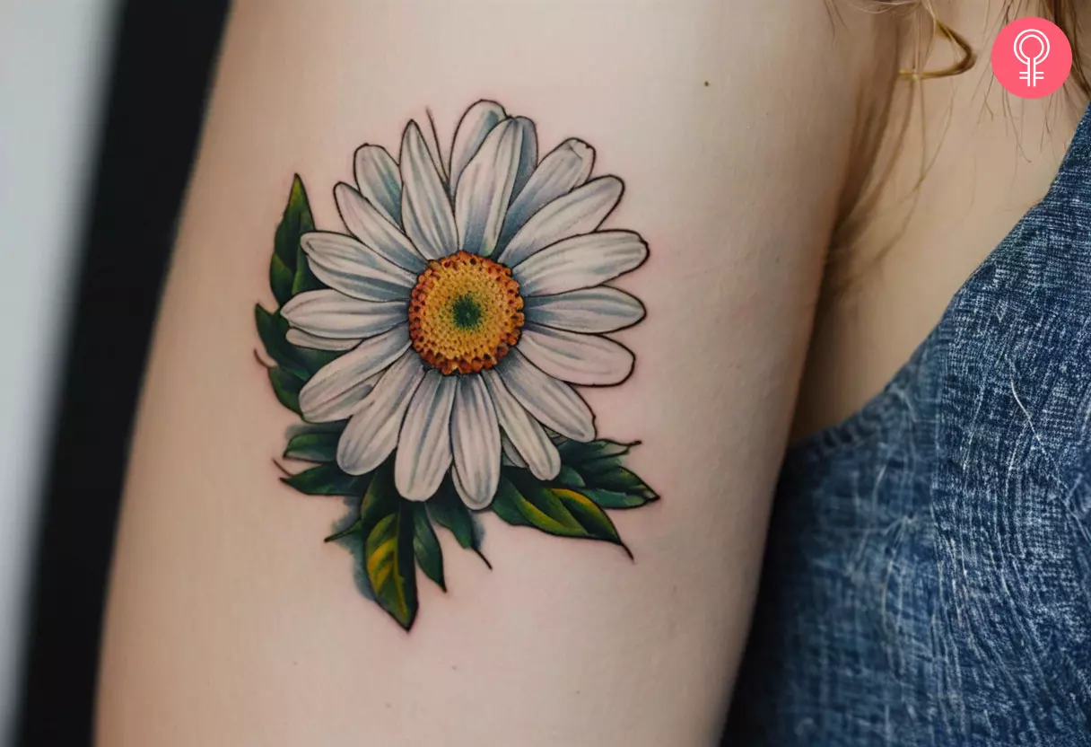 Woman with a traditional daisy tattoo