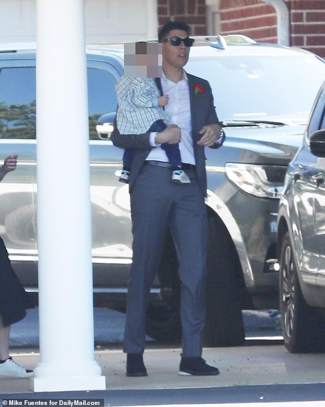 Jackson Mahomes opte for a grey suit, white shirt and dark navy shoes at the funeral