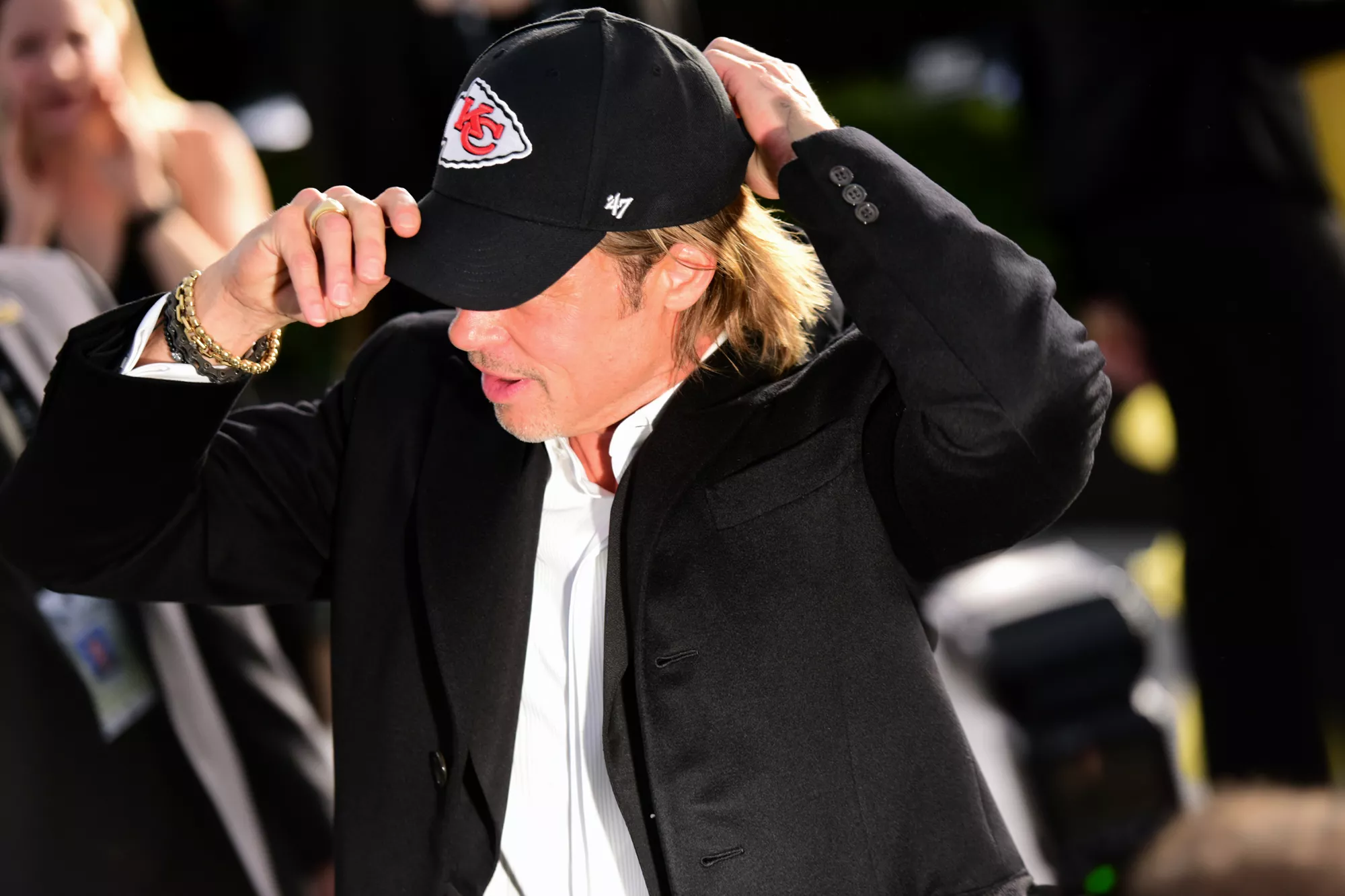 Actor Brad Pitt puts on a Kansas City Chiefs hat at the 26th annual Screen ActorsÂ Guild Awards at The Shrine Auditorium on January 19, 2020 in Los Angeles, California.