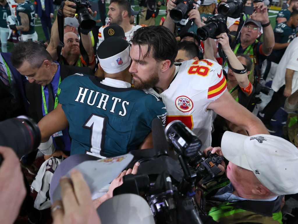 Kelce and Hurts hug after the Eagles beat the Chiefs.