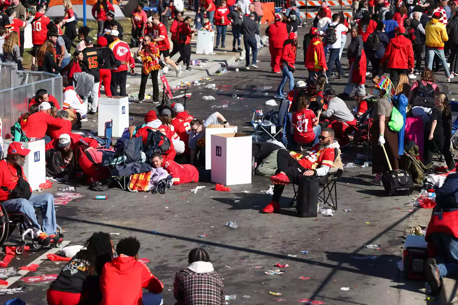  People take cover during a shooting at Union Station during the Kansas City Chiefs Super Bowl LVIII victory parade on February 14, 2024 in Kansas City, Missouri.