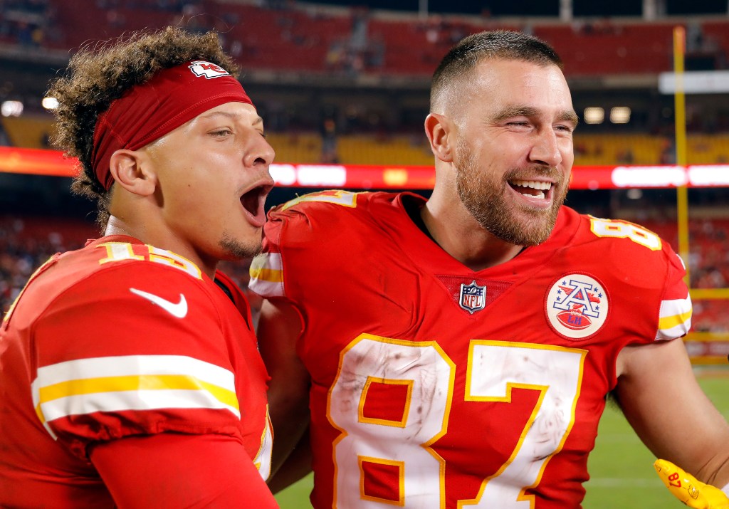 Patrick Mahomes #15 and Travis Kelce #87 of the Kansas City Chiefs celebrate after the Chiefs defeated the Las Vegas Raiders 30-29 to win the game at Arrowhead Stadium on October 10, 2022 in Kansas City, Missouri.