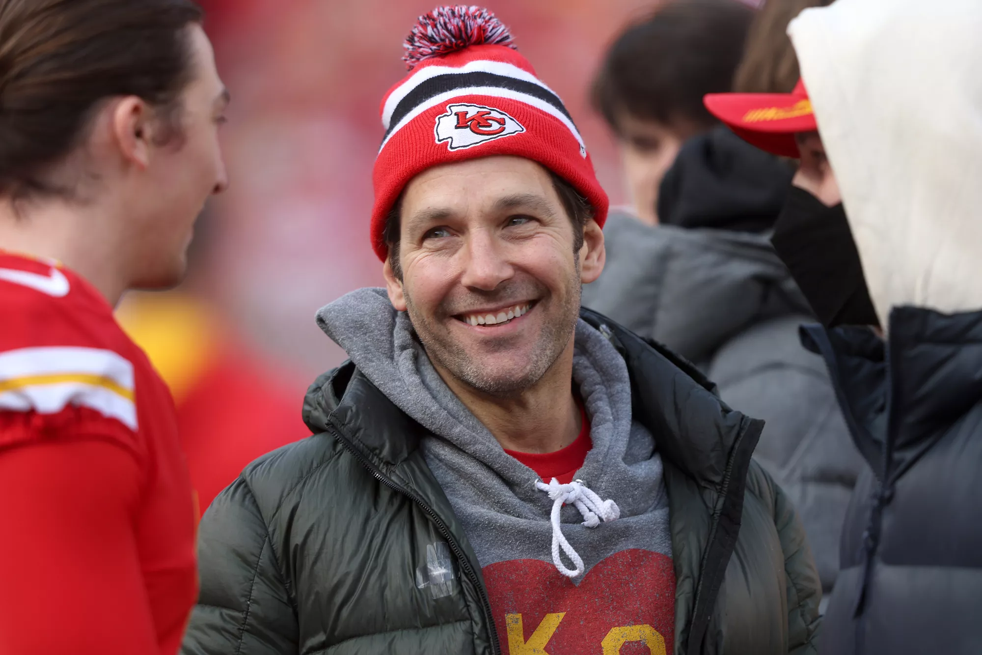 Actor Paul Rudd talks with kicker Harrison Butker #7 of the Kansas City Chiefs before the AFC Championship Game against the Cincinnati Bengals at Arrowhead Stadium on January 30, 2022 in Kansas City, Missouri.