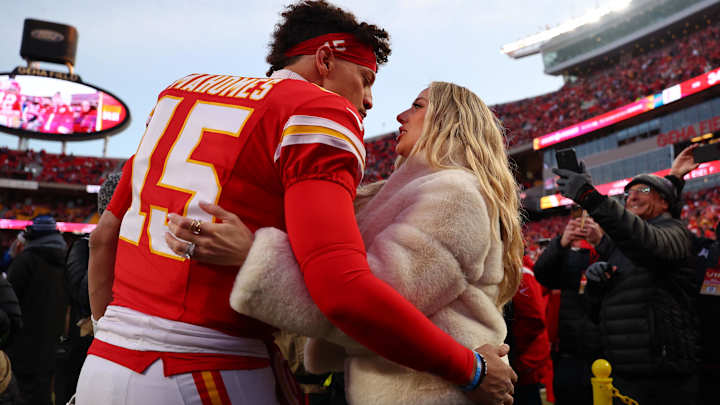 Kansas City Chiefs quarterback Patrick Mahomes (15) and Brittany Mahomes react before the AFC Championship game against the Buffalo Bills at GEHA Field at Arrowhead Stadium.