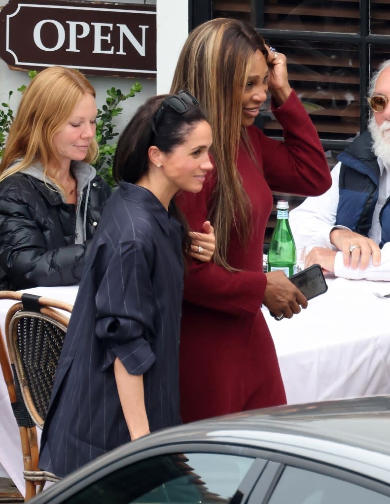 Meghan Markle linked arms with Serena Williams while grabbing lunch in Montecito, Calif., on Saturday. Clint Brewer Photography / BACKGRID