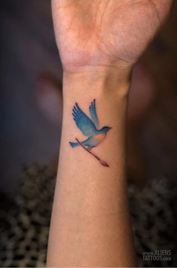 small color bird tattoo