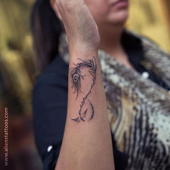 small infinity sign feature tattoo