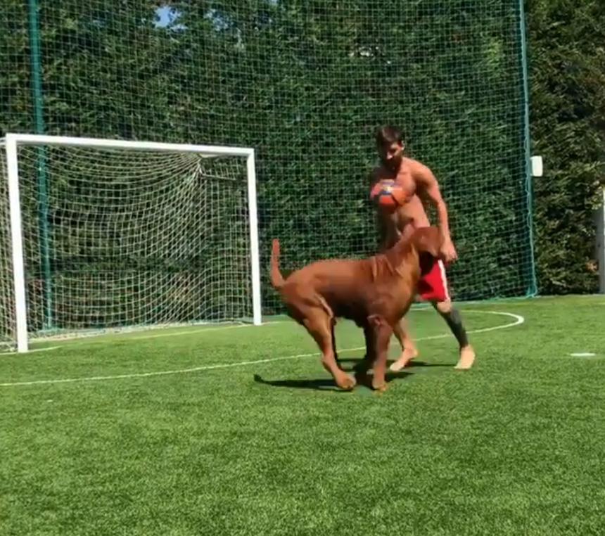 Barcelona ace Lionel Messi toyed with his huge pet dog in his garden