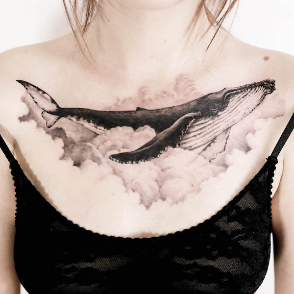 Dreamy whale chest tattoo by @tattooist_doy